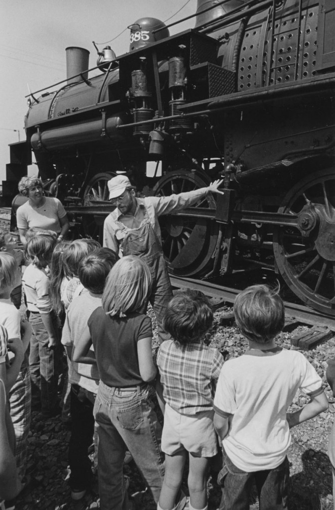 Tom O'Brien Jr. explaining locomotive to children