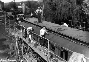 Roofing work on coach car in 1984.