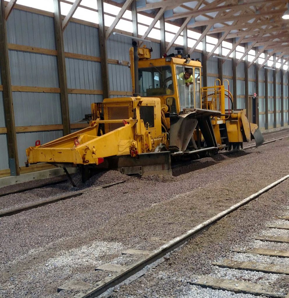 tamper machine spreading gravel