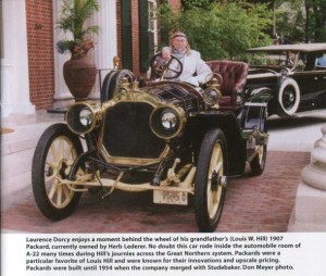 Laurence Dorcy behind wheel of 1907 Packard